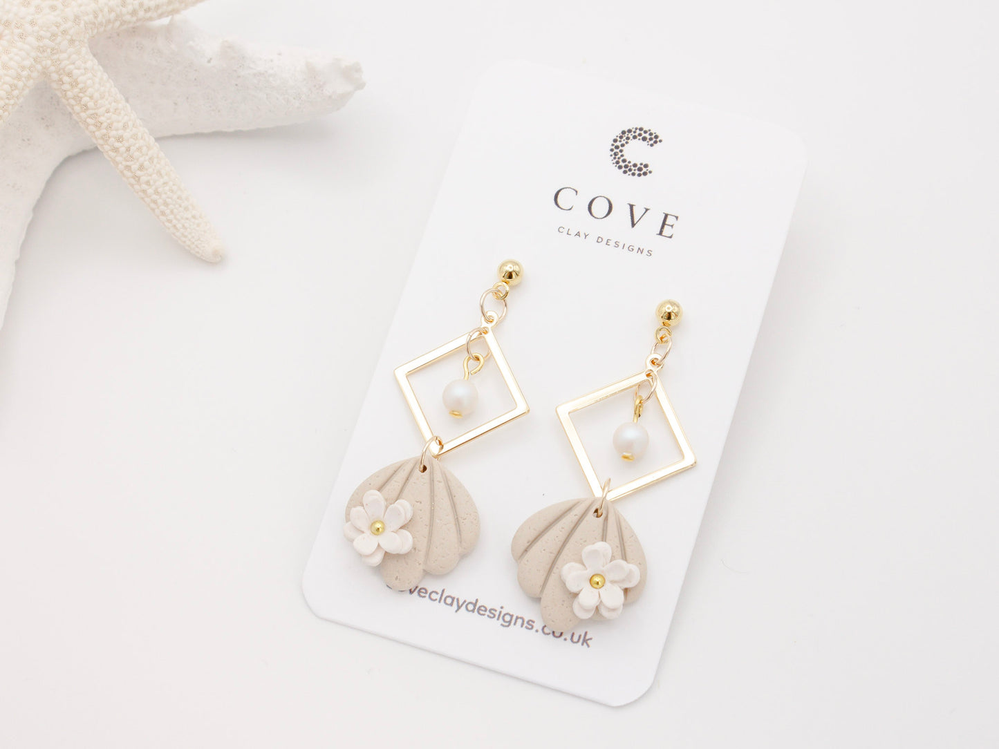 Handmade Beach Shell Polymer Clay Earrings with White Flower by Cove Clay Designs