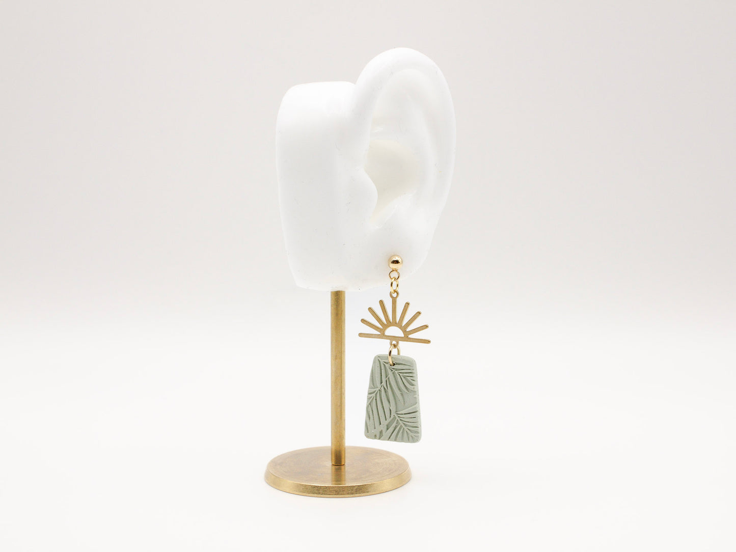 Handmade gold half sun and green tropical texture dangle polymer clay earrings by Cove Clay Designs