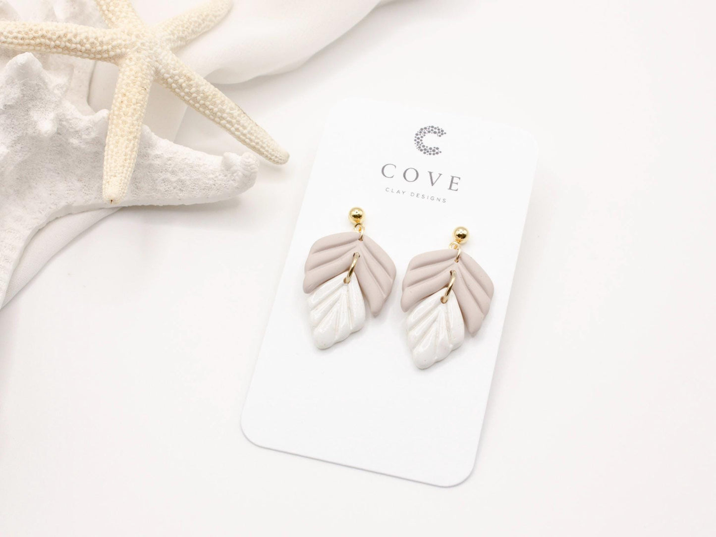 Handmade mauve and white leaf polymer clay earrings by Cove Clay Designs
