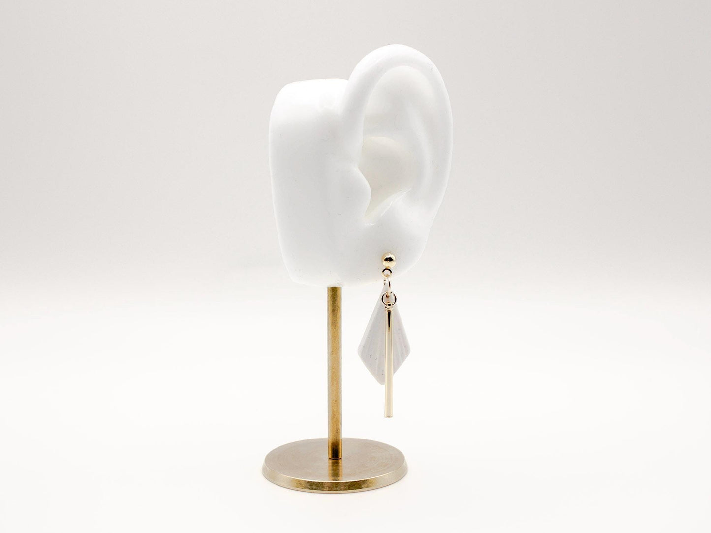 Handmade white diamond shaped polymer clay earrings with gold bar by Cove Clay Designs