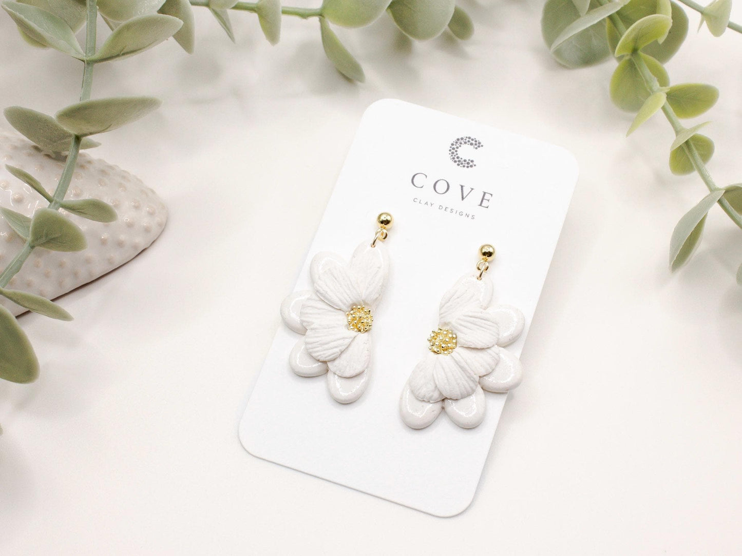 Handmade white flower polymer clay earrings by Cove Clay Designs