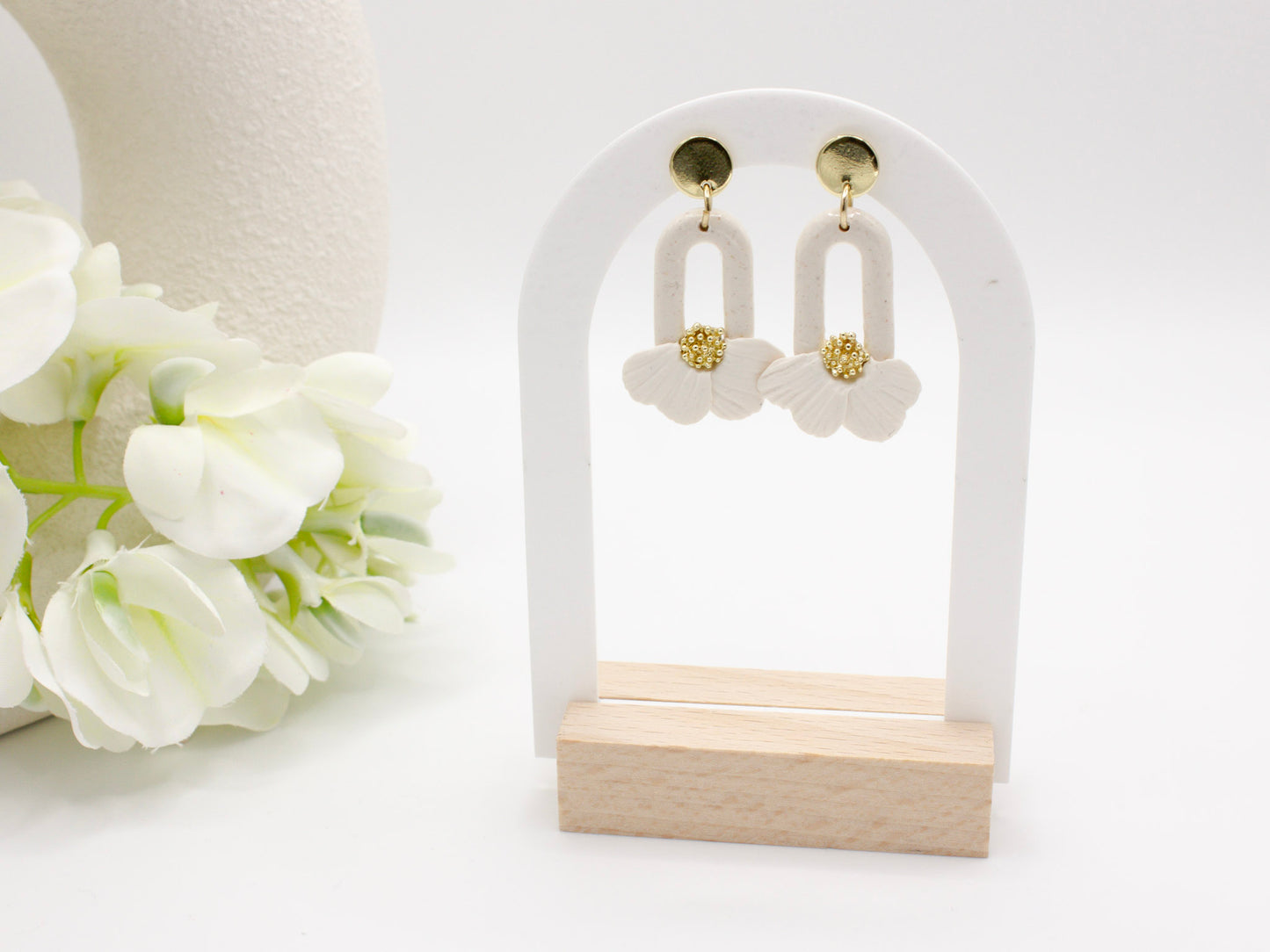 Handmade white flower petal hoop polymer clay earrings by Cove Clay Designs