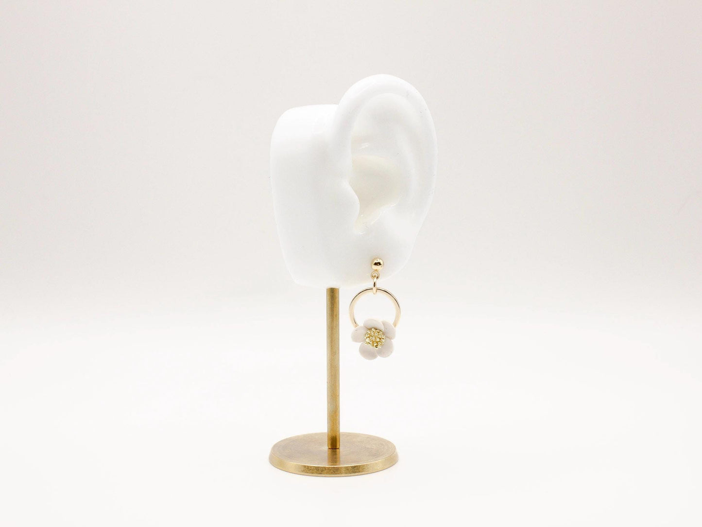 Handmade white flower hoop polymer clay earrings by Cove Clay Designs