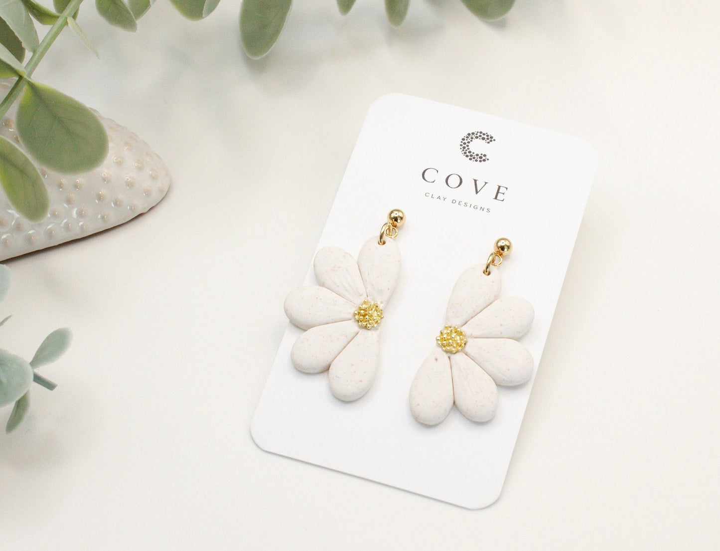 Handmade white flower polymer clay earrings with gold stud posts by Cove Clay Designs