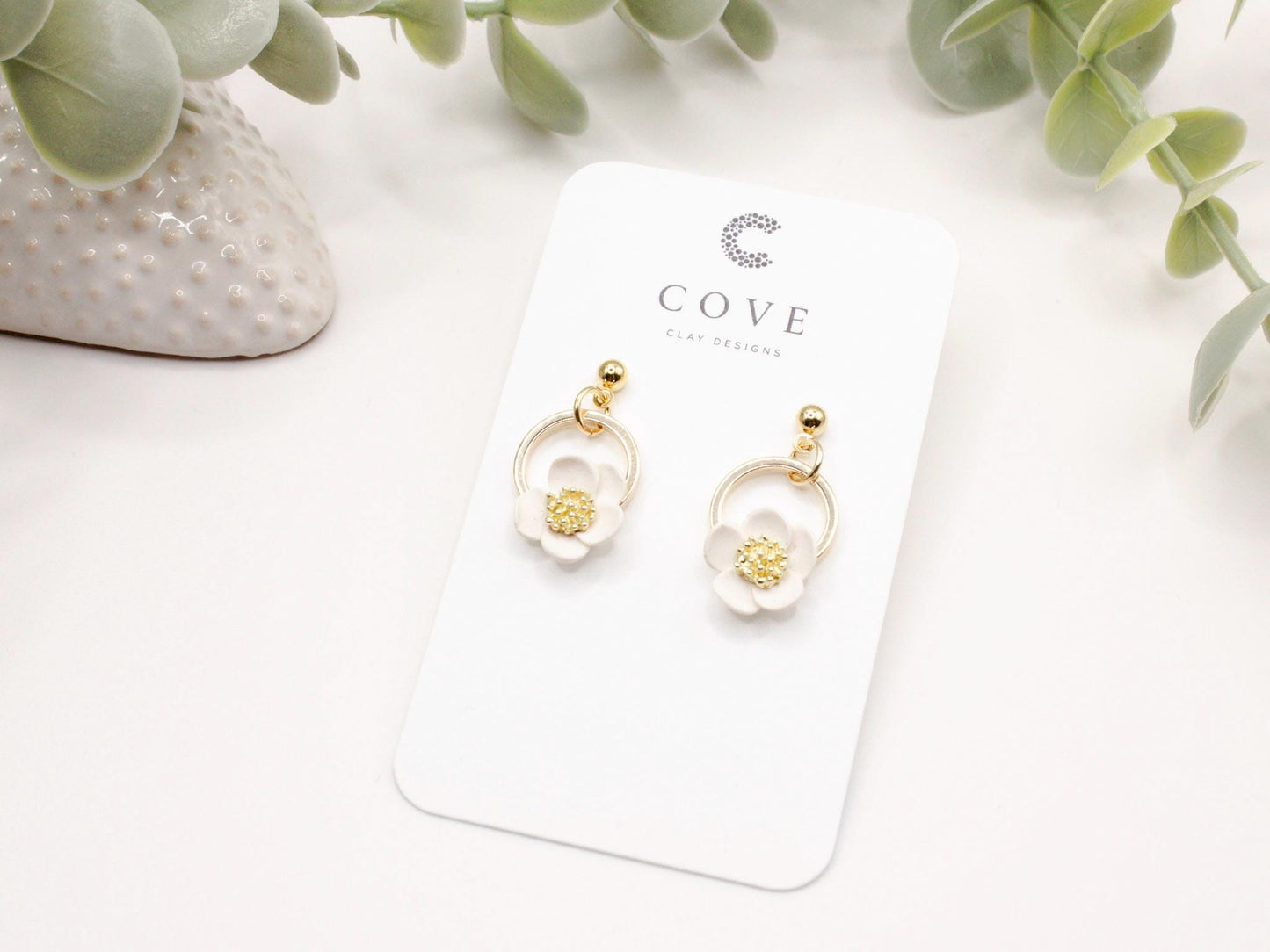 Handmade white flower hoop polymer clay earrings by Cove Clay Designs