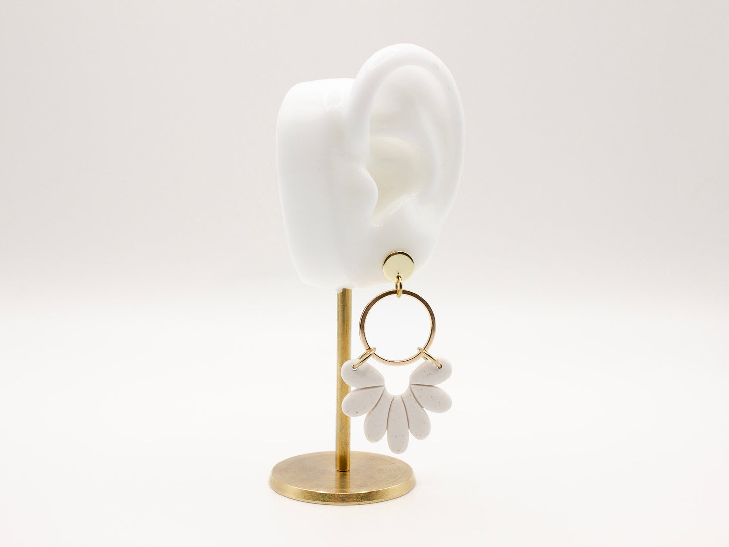 Handmade white sand effect scallop shell hoop dangle clay earrings with gold posts and round connectors by Cove Clay Designs