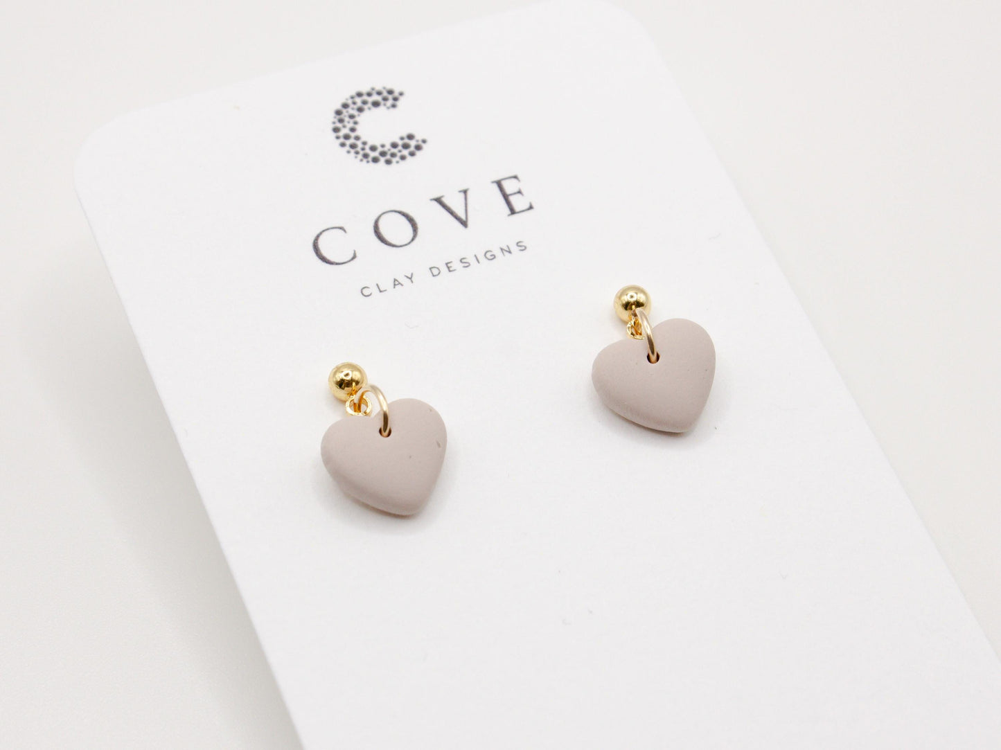 Handmade mini mauve heart polymer clay earrings by Cove Clay Designs