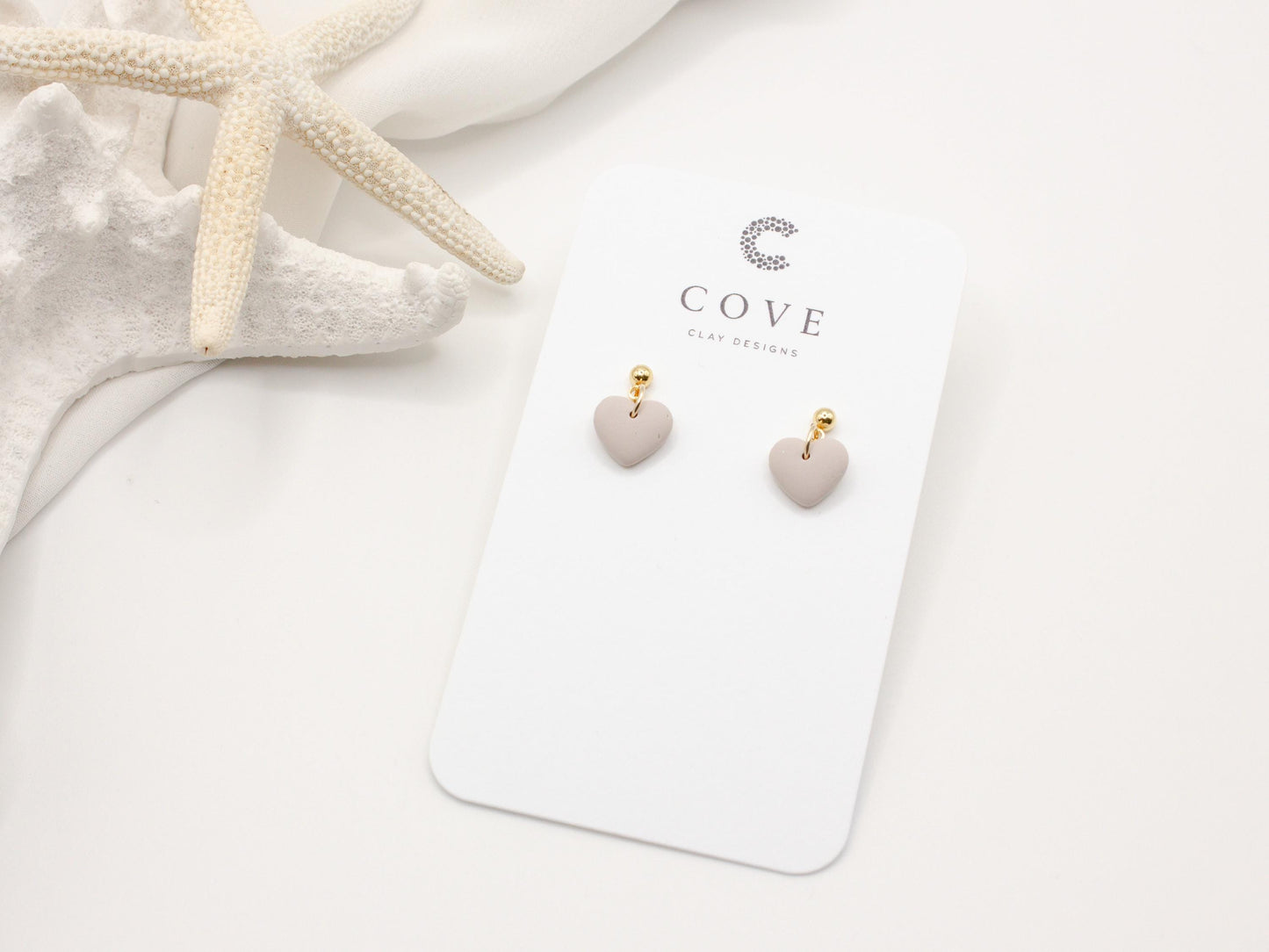 Handmade mini mauve heart polymer clay earrings by Cove Clay Designs