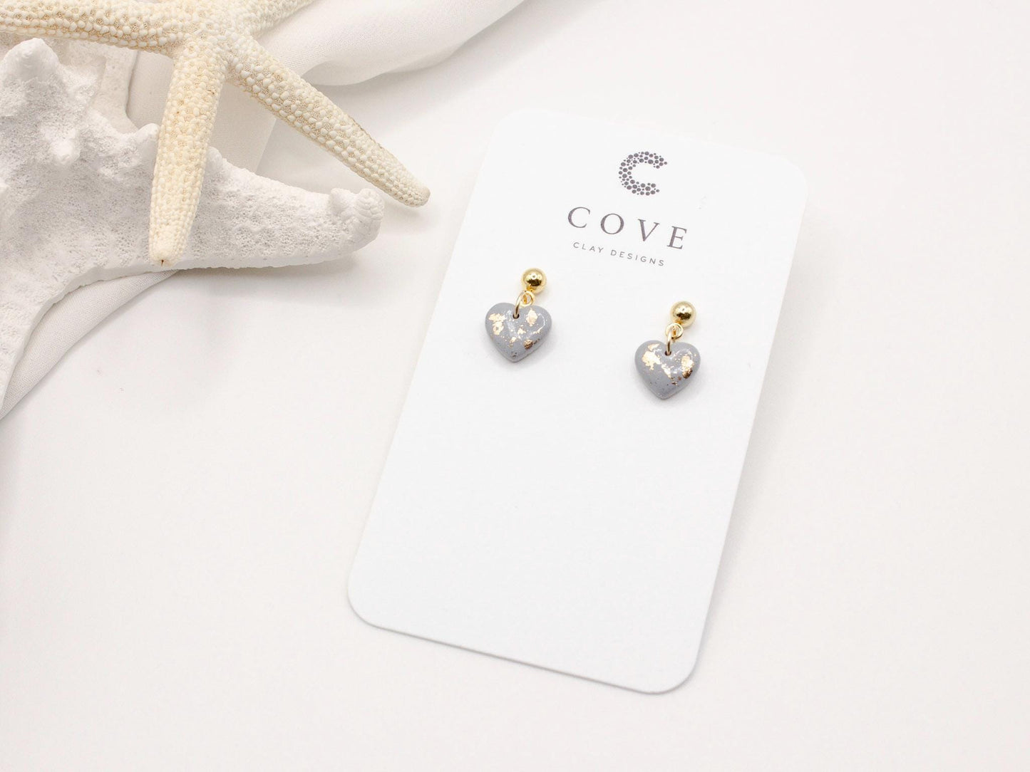 Handmade dusty blue and speckled gold mini heart polymer clay earrings