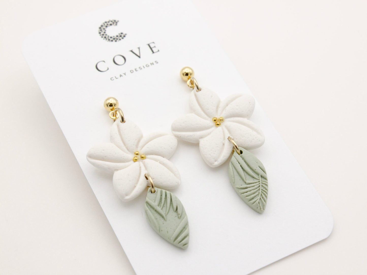 Handmade white plumeria tropical Hawaiian flower clay earrings by Cove Clay Designs