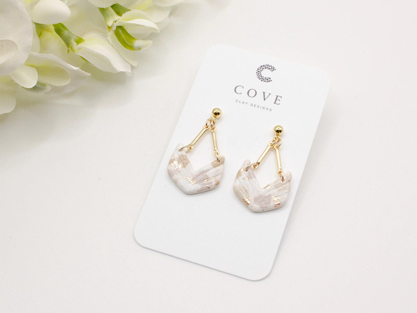 Handmade terrazzo geometric chevron clay earrings with gold stud posts.