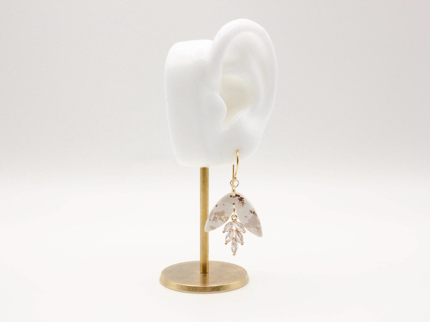 Handmade terrazzo leaf dangle clay earrings with gold hooks and cubic zirconia charms by Cove Clay Designs