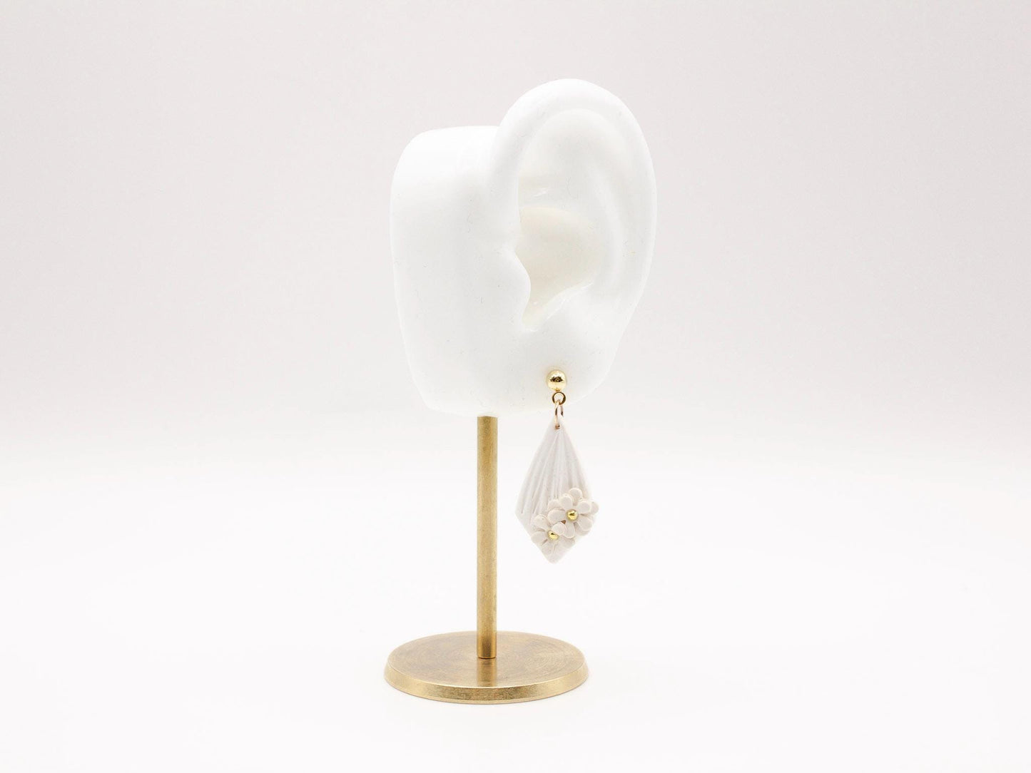 Handmade white diamond shaped polymer clay earrings with gold bar and mini flowers by Cove Clay Designs
