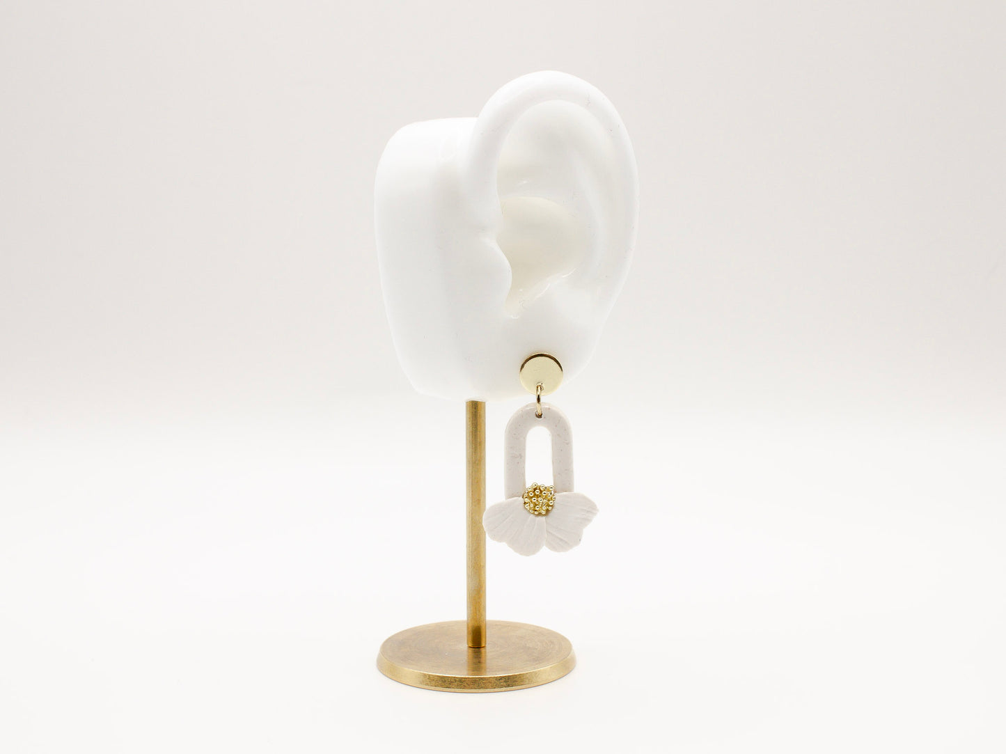 Handmade white flower petal hoop polymer clay earrings by Cove Clay Designs