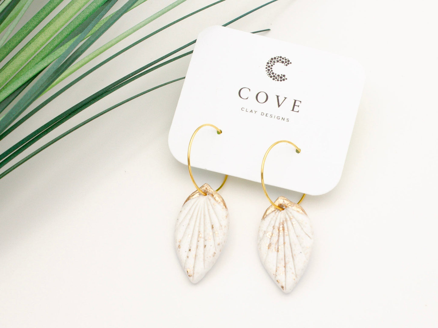 Handmade white and gold tropical leaf clay hoop earrings