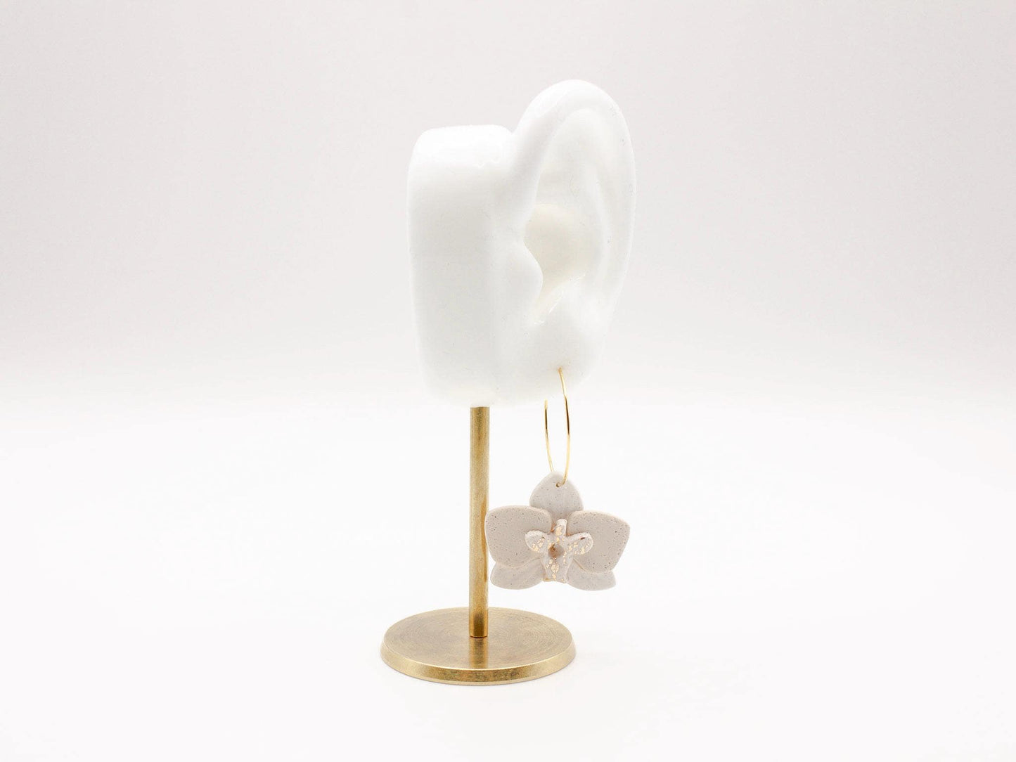 Handmade white orchid flower clay hoop earrings by Cove Clay Designs