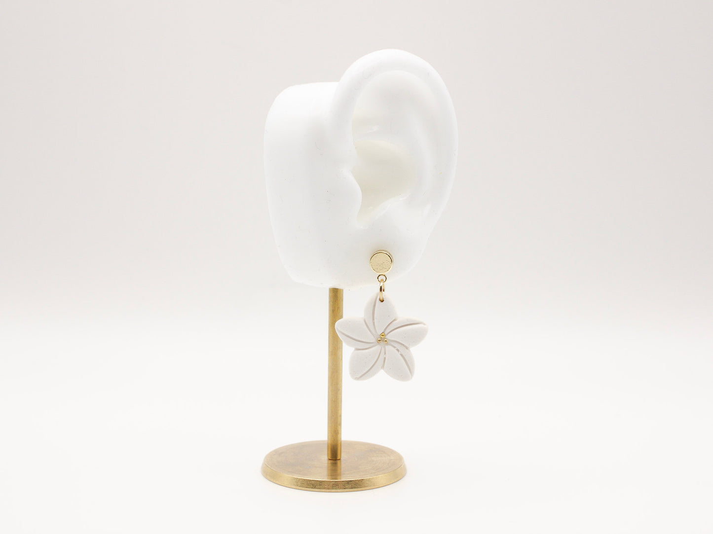 Handmade white plumeria Hawaiian tropical flower clay earrings by Cove Clay Designs