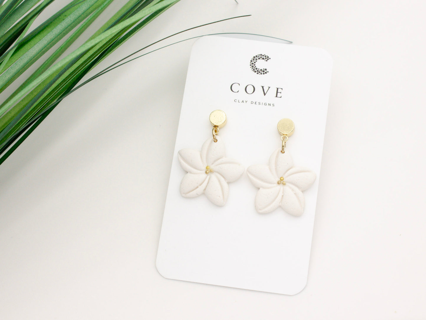 Handmade white plumeria Hawaiian tropical flower clay earrings by Cove Clay Designs