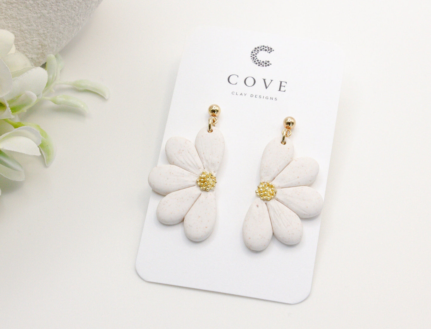 Handmade white flower polymer clay earrings with gold stud posts by Cove Clay Designs