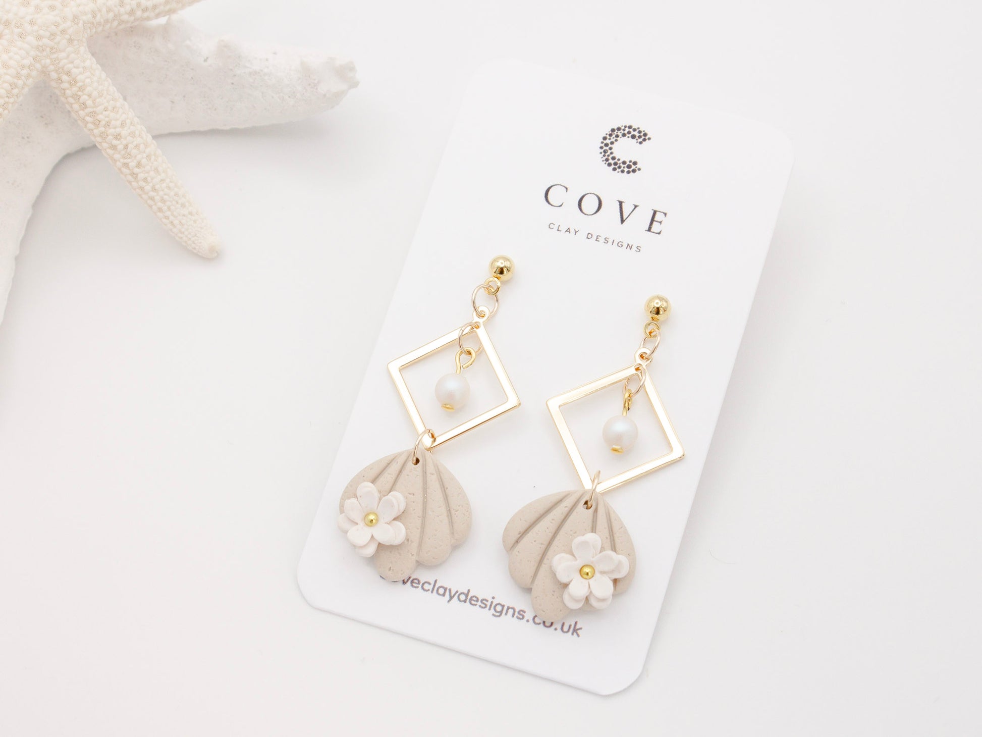 Handmade Beach Shell Polymer Clay Earrings with White Flower by Cove Clay Designs