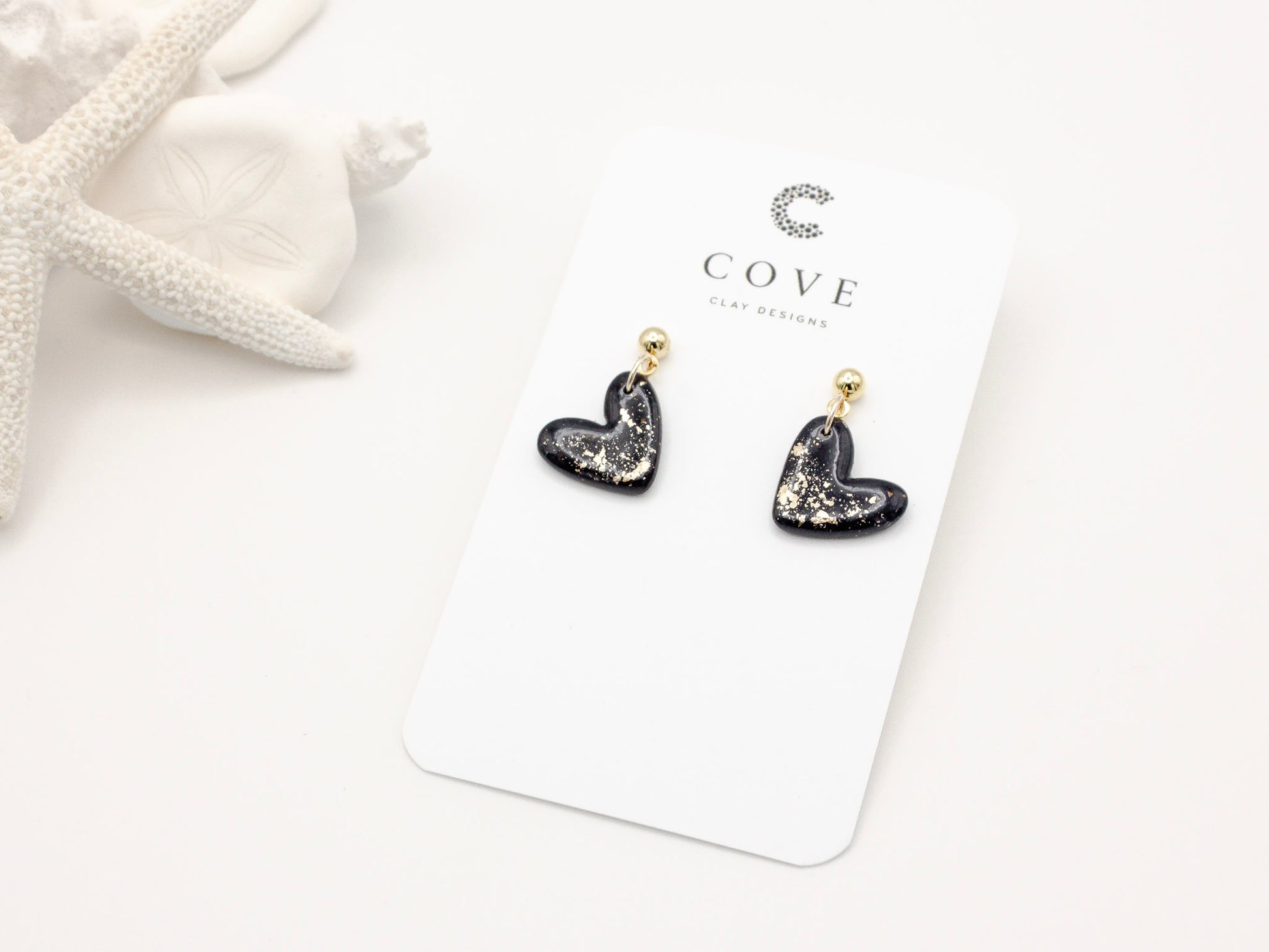 Handmade black and gold fleck mini heart polymer clay earrings by Cove Clay Designs