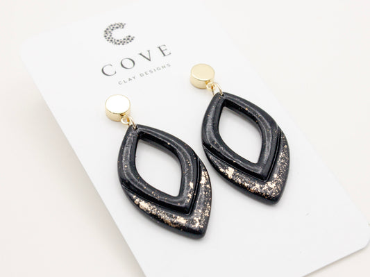 Handmade black and gold fleck double drop polymer clay earrings by Cove Clay Designs