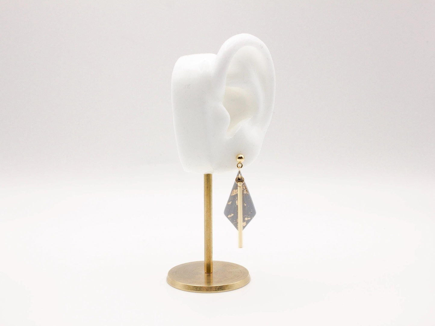 Handmade dusty blue and speckled gold diamond shaped polymer clay earrings with gold bar
