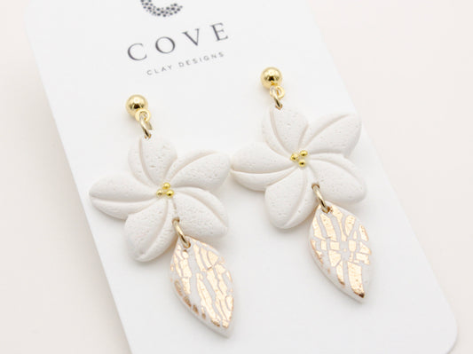 Handmade white plumeria tropical flower clay earrings by Cove Clay Designs