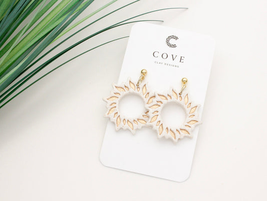 Handmade gold sun dangle clay earrings with gold posts by Cove Clay Designs