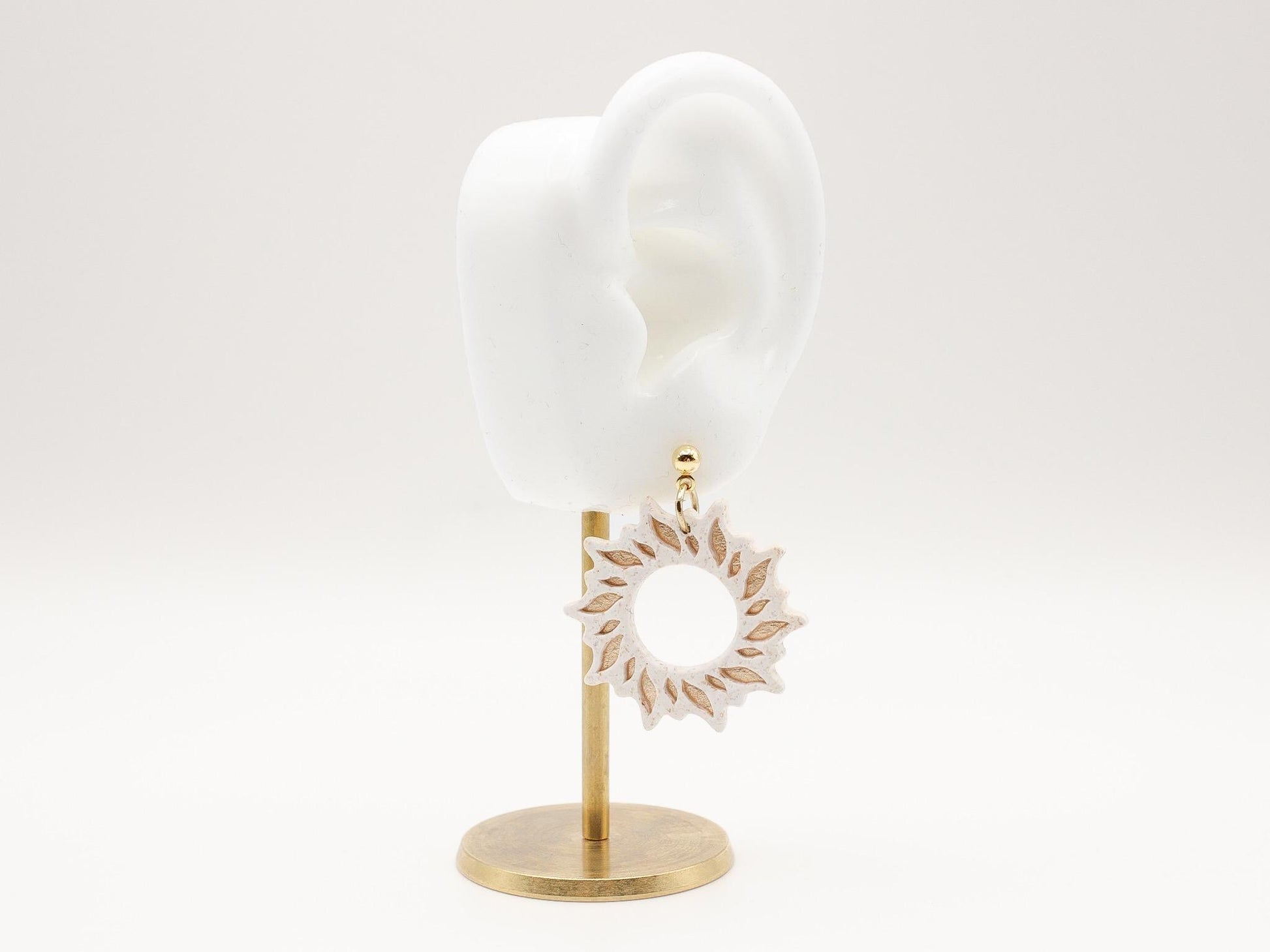 Handmade gold sun dangle clay earrings with gold posts by Cove Clay Designs
