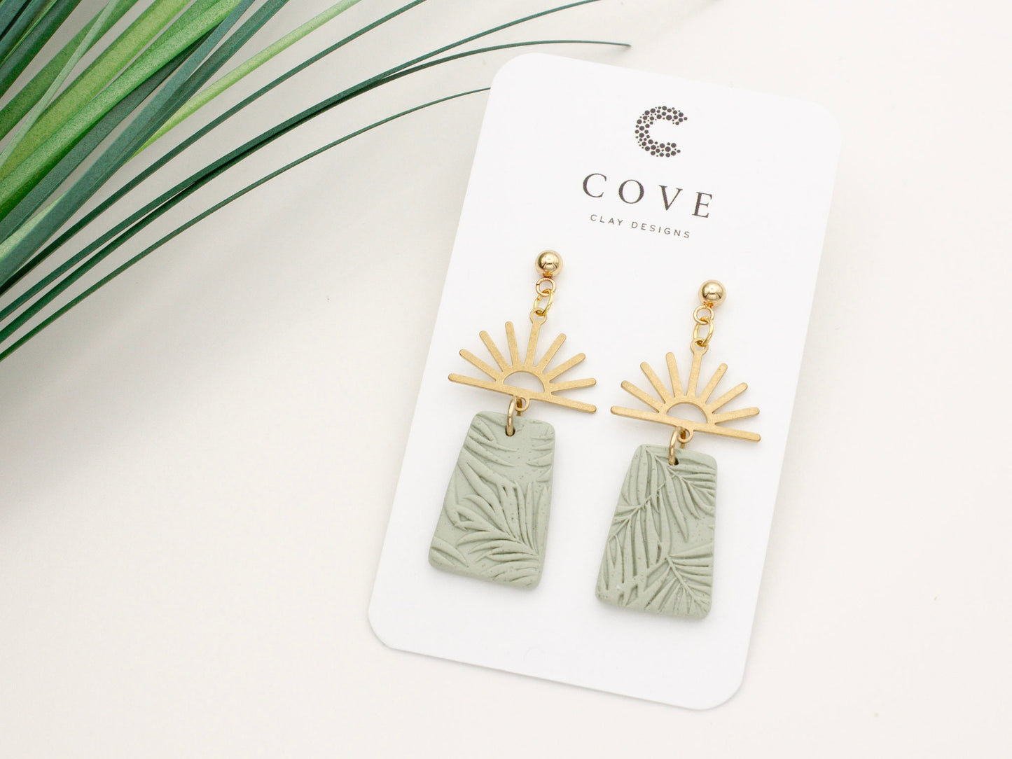 Handmade gold half sun and green tropical texture dangle polymer clay earrings by Cove Clay Designs