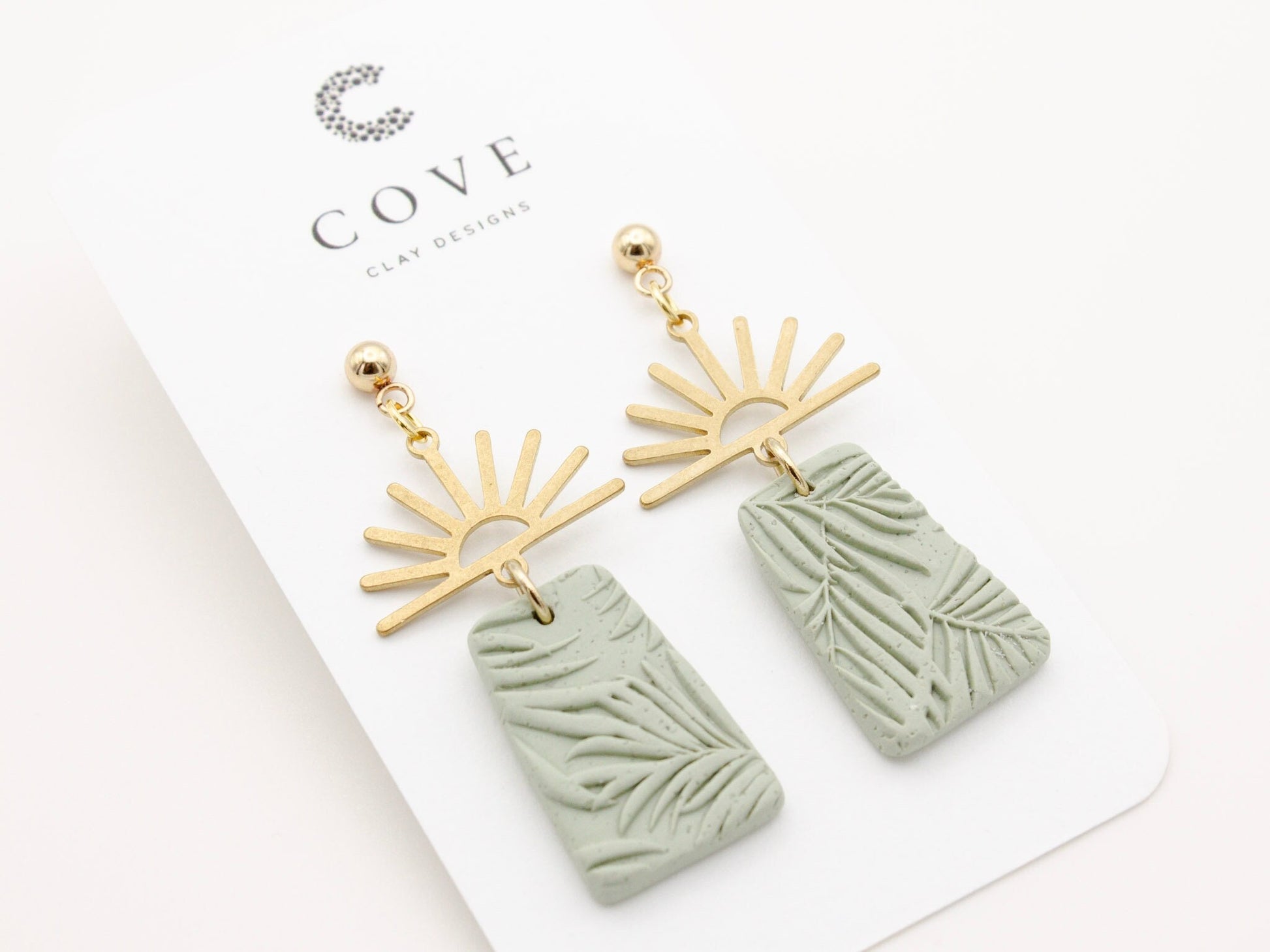 Handmade gold half sun and green tropical texture dangle polymer clay earrings by Cove Clay Designs