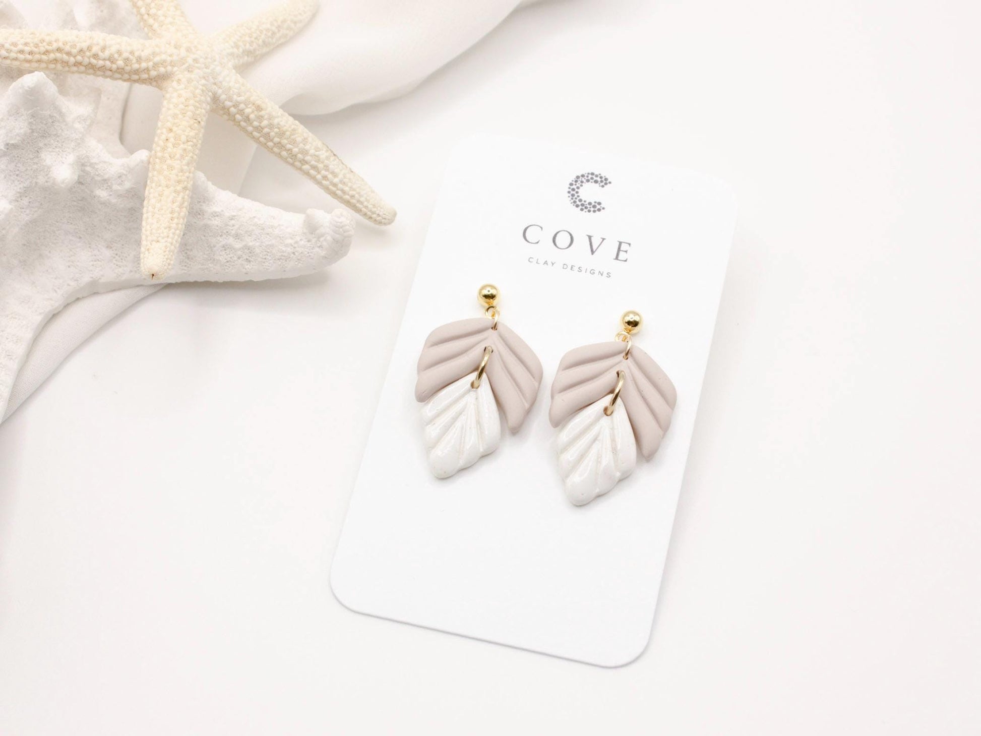 Handmade mauve and white leaf polymer clay earrings by Cove Clay Designs