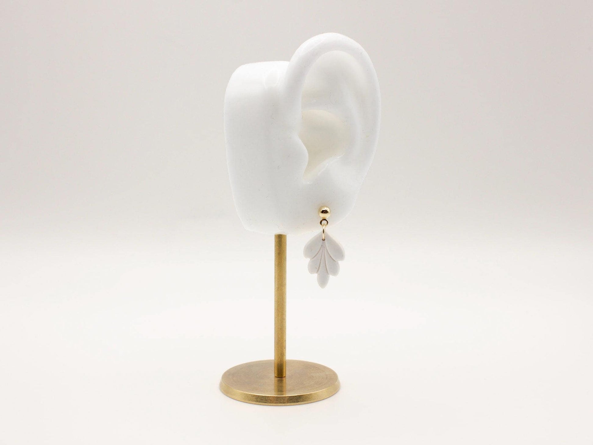 Handmade mini white leaf polymer clay earrings by Cove Clay Designs