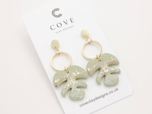 Handmade tropical leaf green polymer clay dangle earrings, perfect for your beach and summer outfits.

