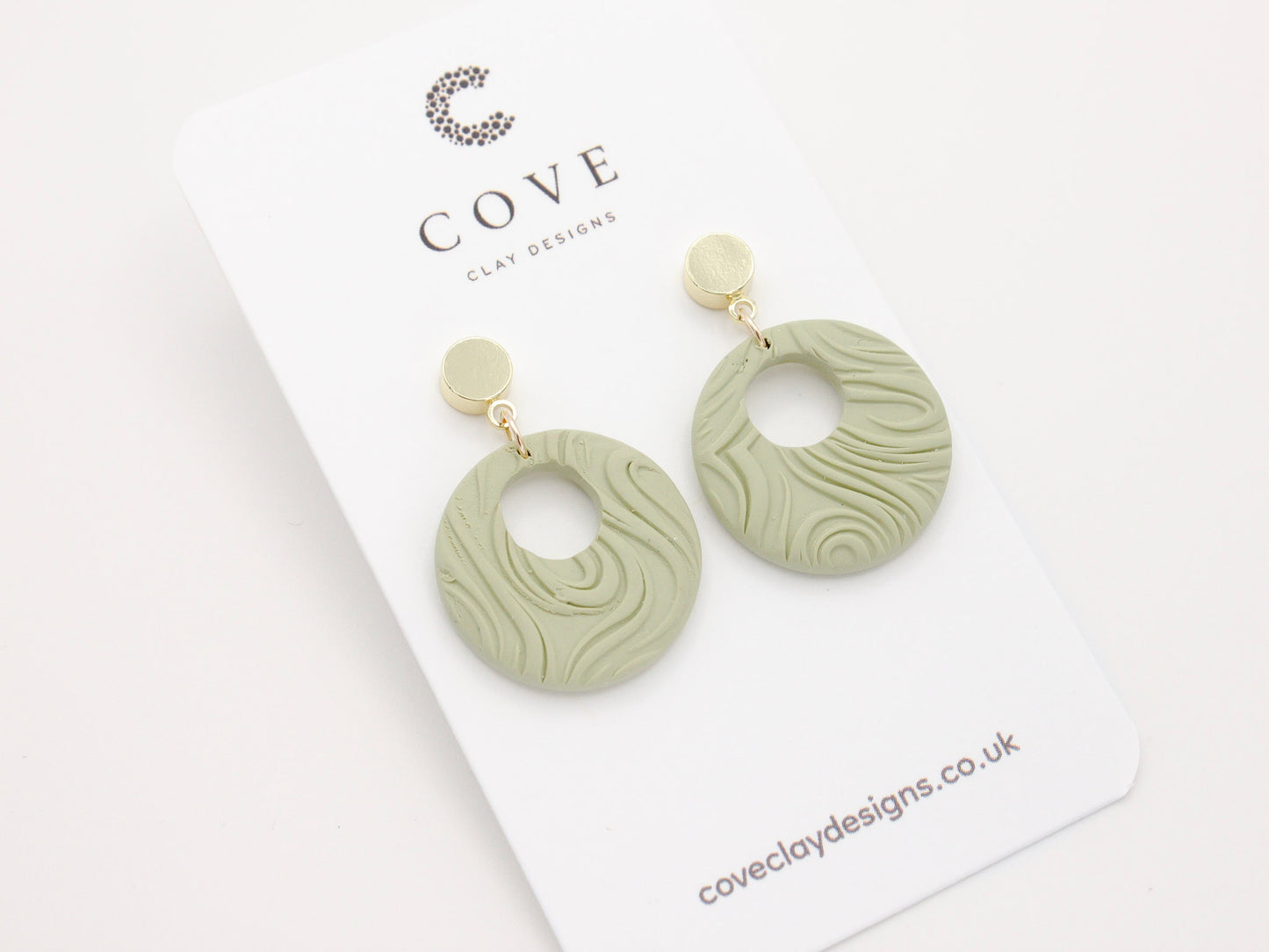 Handmade Round Green Swirl Polymer Clay Earrings for Women by Cove. Perfect for your beach and summer outfits.