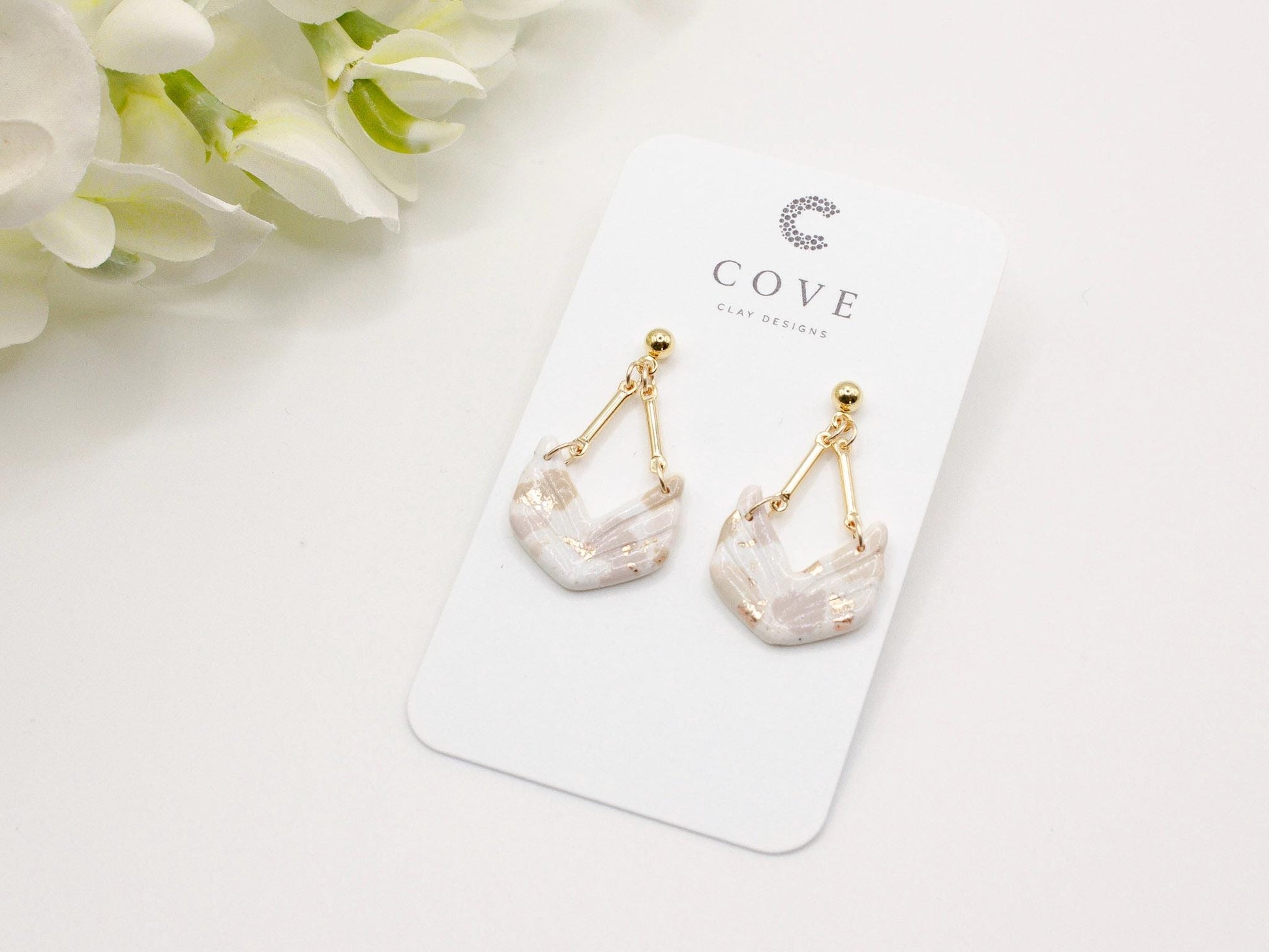 Handmade terrazzo geometric chevron clay earrings with gold stud posts.
