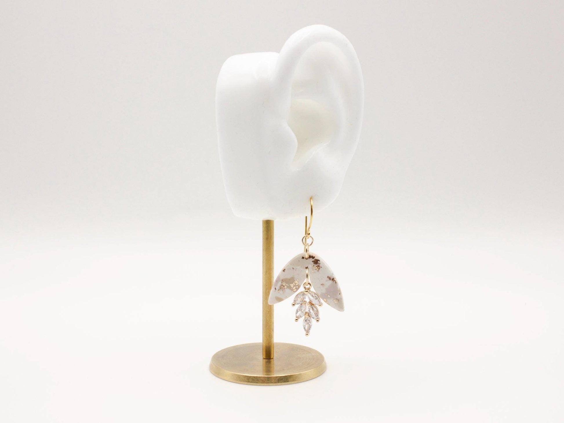 Handmade terrazzo leaf dangle clay earrings with gold hooks and cubic zirconia charms by Cove Clay Designs