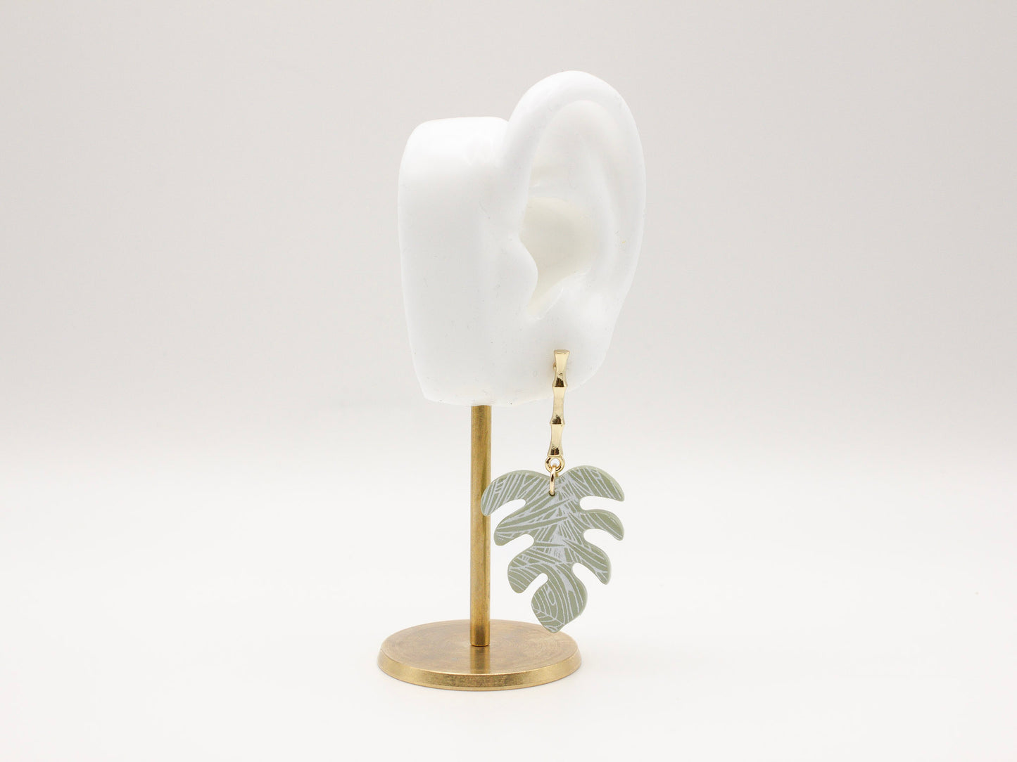 Handmade tropical green palm leaf clay earrings with gold posts by Cove Clay Designs