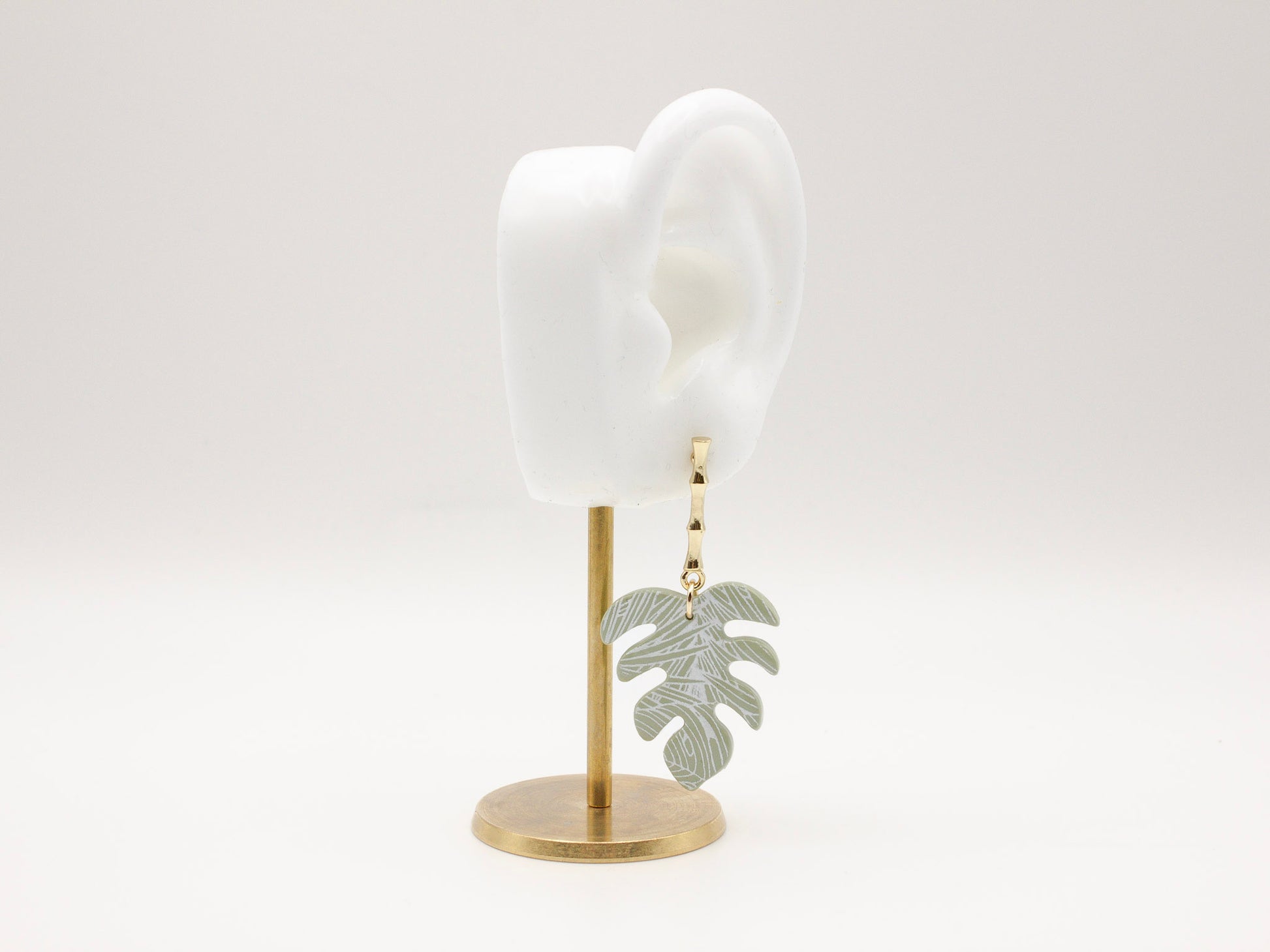 Handmade tropical green palm leaf clay earrings with gold posts by Cove Clay Designs