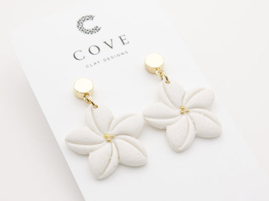 Handmade white plumeria Hawaiian tropical flower clay earrings by Cove Clay Designs