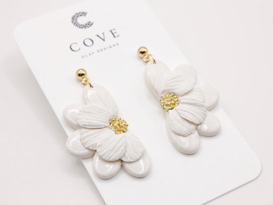 Handmade white flower polymer clay earrings by Cove Clay Designs