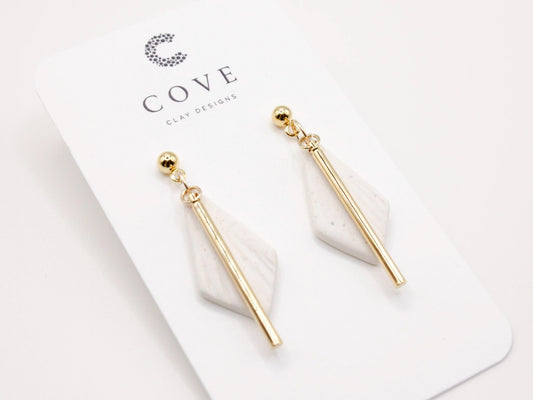 Handmade white diamond shaped polymer clay earrings with gold bar by Cove Clay Designs