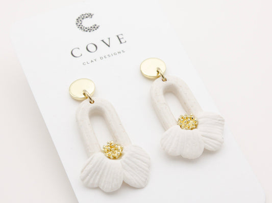 Handmade white flower petal hoop polymer clay earrings by Cove Clay Designs