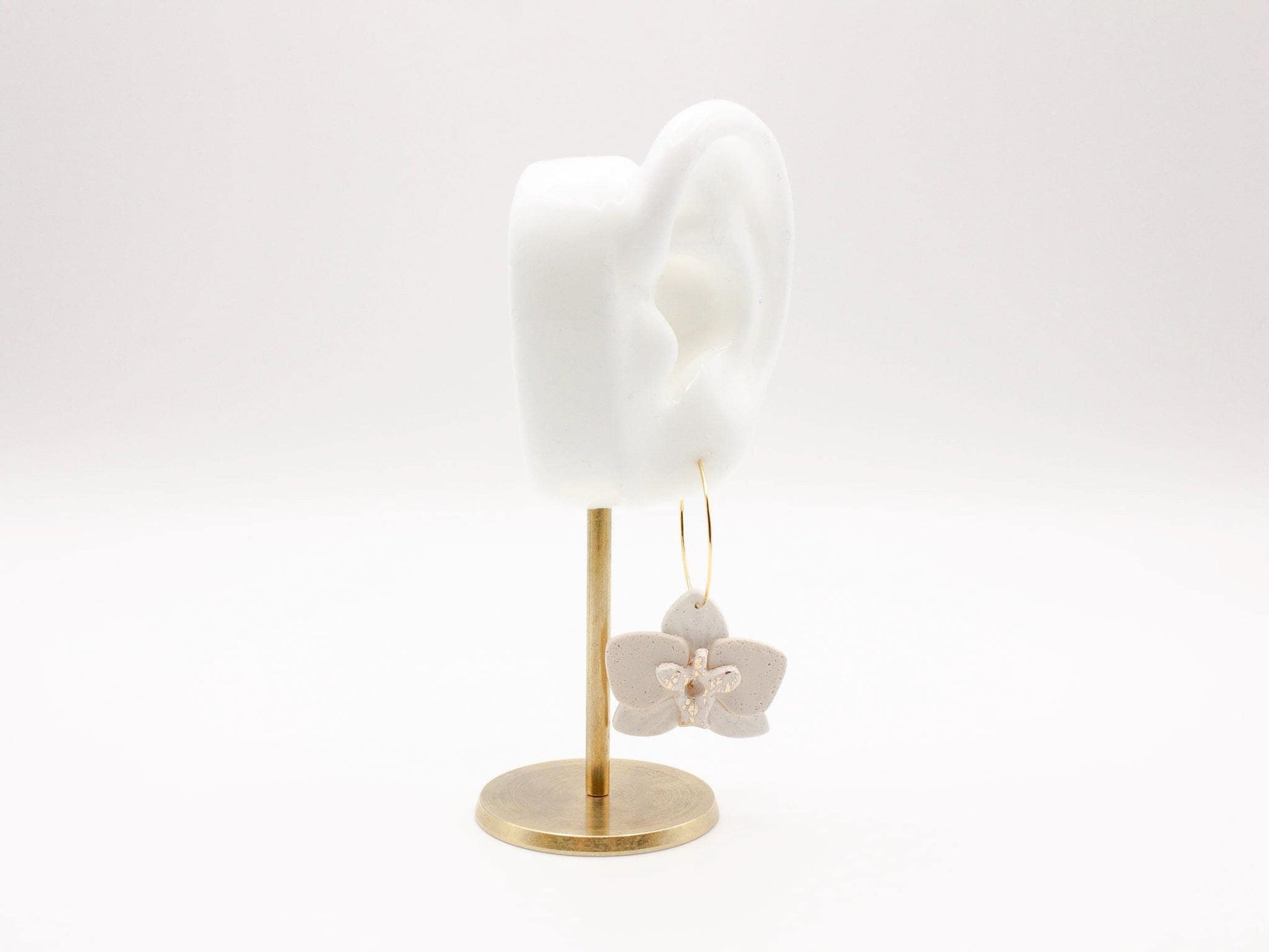 Handmade white orchid flower clay hoop earrings by Cove Clay Designs