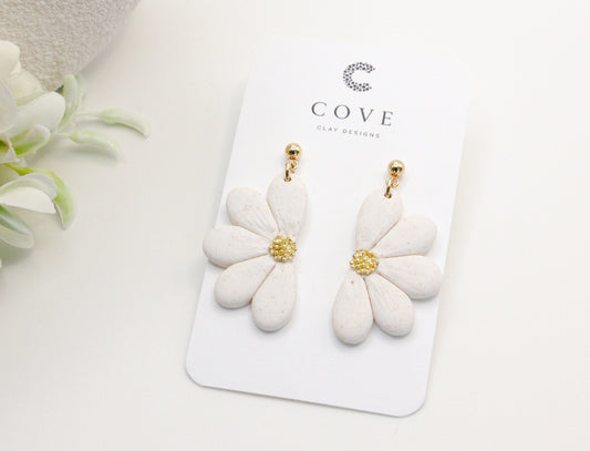 Handmade white flower polymer clay earrings with gold stud posts by Cove Clay Designs
