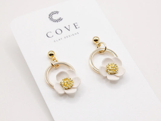 Handmade white flower hoop polymer clay earrings by Cove Clay Designs